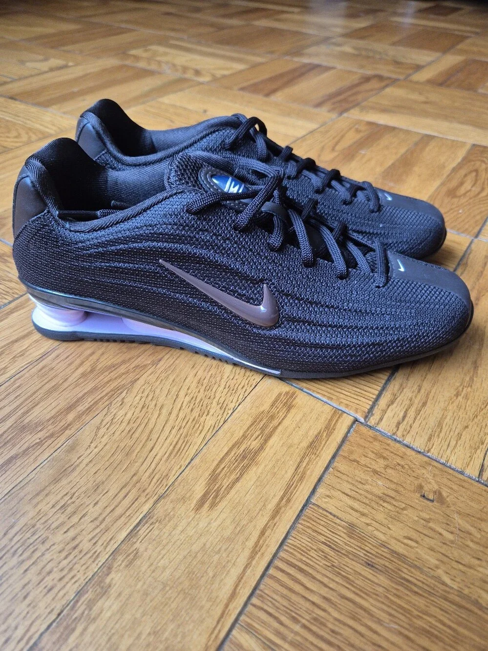 Nike Women’s Black Sneakers with Rose Metallic Swoosh